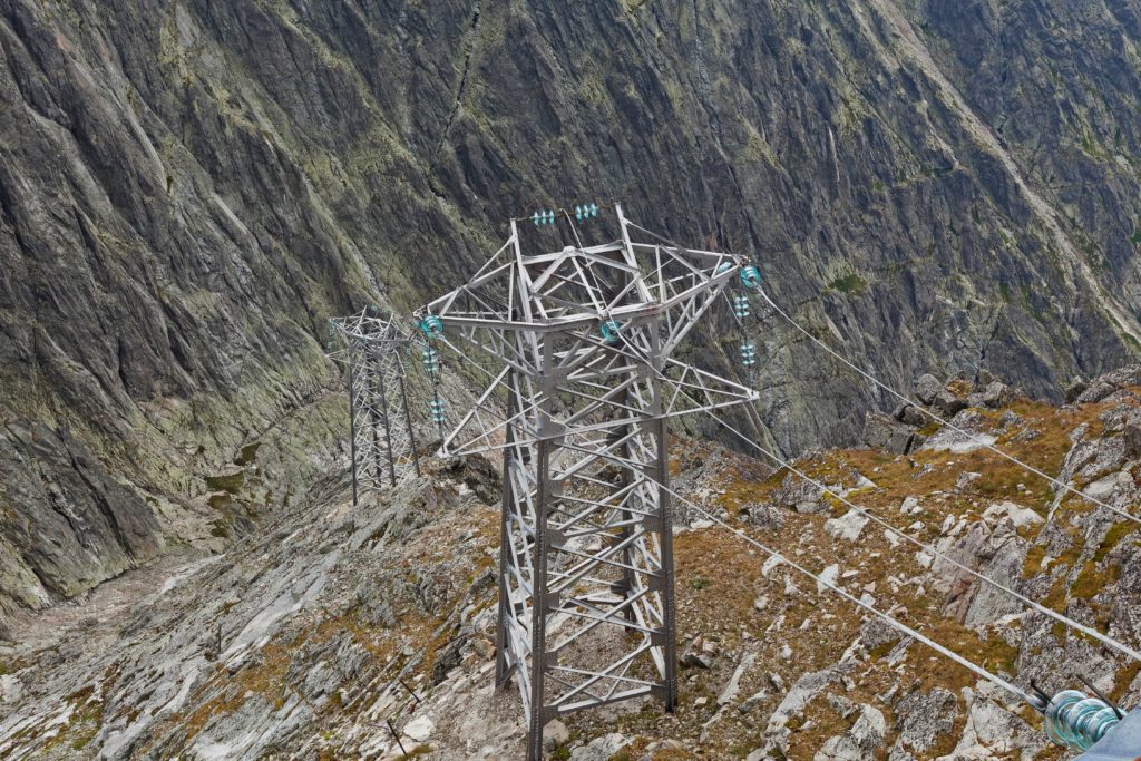 electric-power-line-in-extremely-high-rocky-mounta-2022-02-02-05-04-55-utc-min
